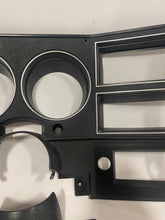 Load image into Gallery viewer, 1984-1987 Good Used dash bezel, black with silver trim