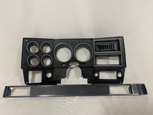 Load image into Gallery viewer, 1984-1987 Good Used dash bezel, black with silver trim; New AC vent, and passenger side plate