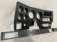 Load image into Gallery viewer, 1984-1987 Good Used dash bezel, black with silver trim; New AC vent, and passenger side plate