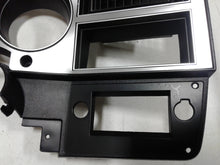 Load image into Gallery viewer, 1981-1983 Good Used dash bezel with brushed aluminum and silver trim, AC vent, and passenger side plate