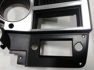 1981-1983 Good Used dash bezel with brushed aluminum and silver trim, AC vent, and passenger side plate