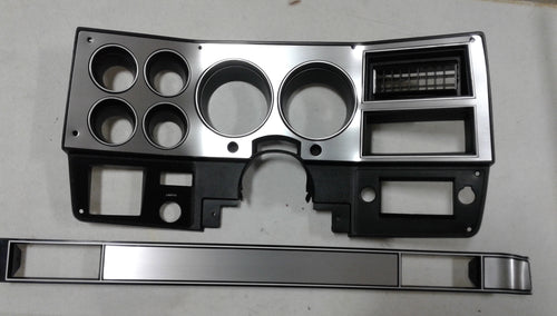 1981-1983 Good Used dash bezel with brushed aluminum and silver trim, AC vent, and passenger side plate